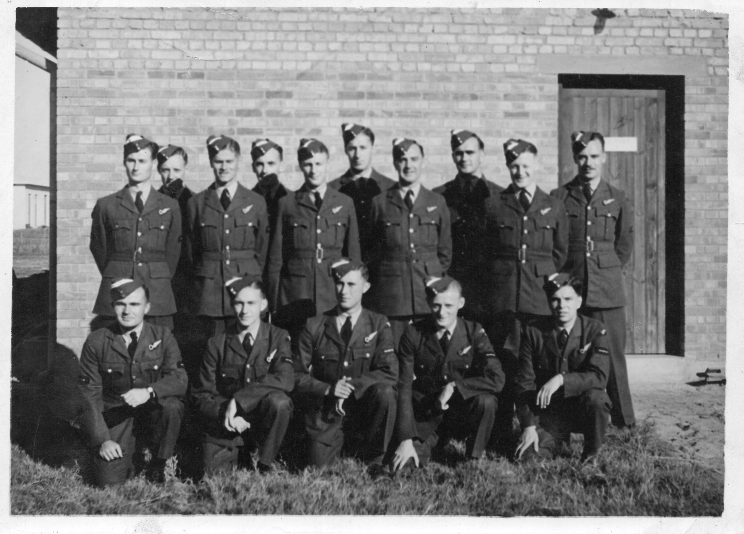 Group of 15 airmen, J C McGhee, front, 2nd from left