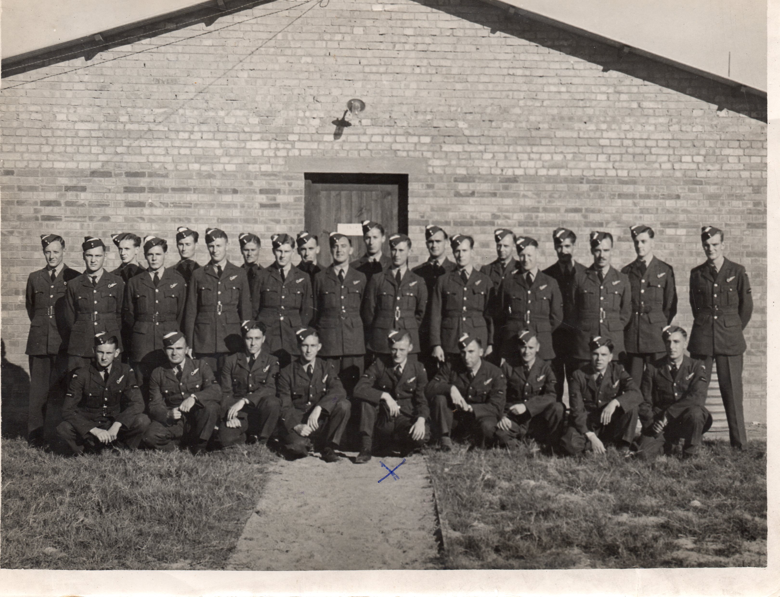 Group of 29 airmen, J C McGhee is indicated by the
          X.