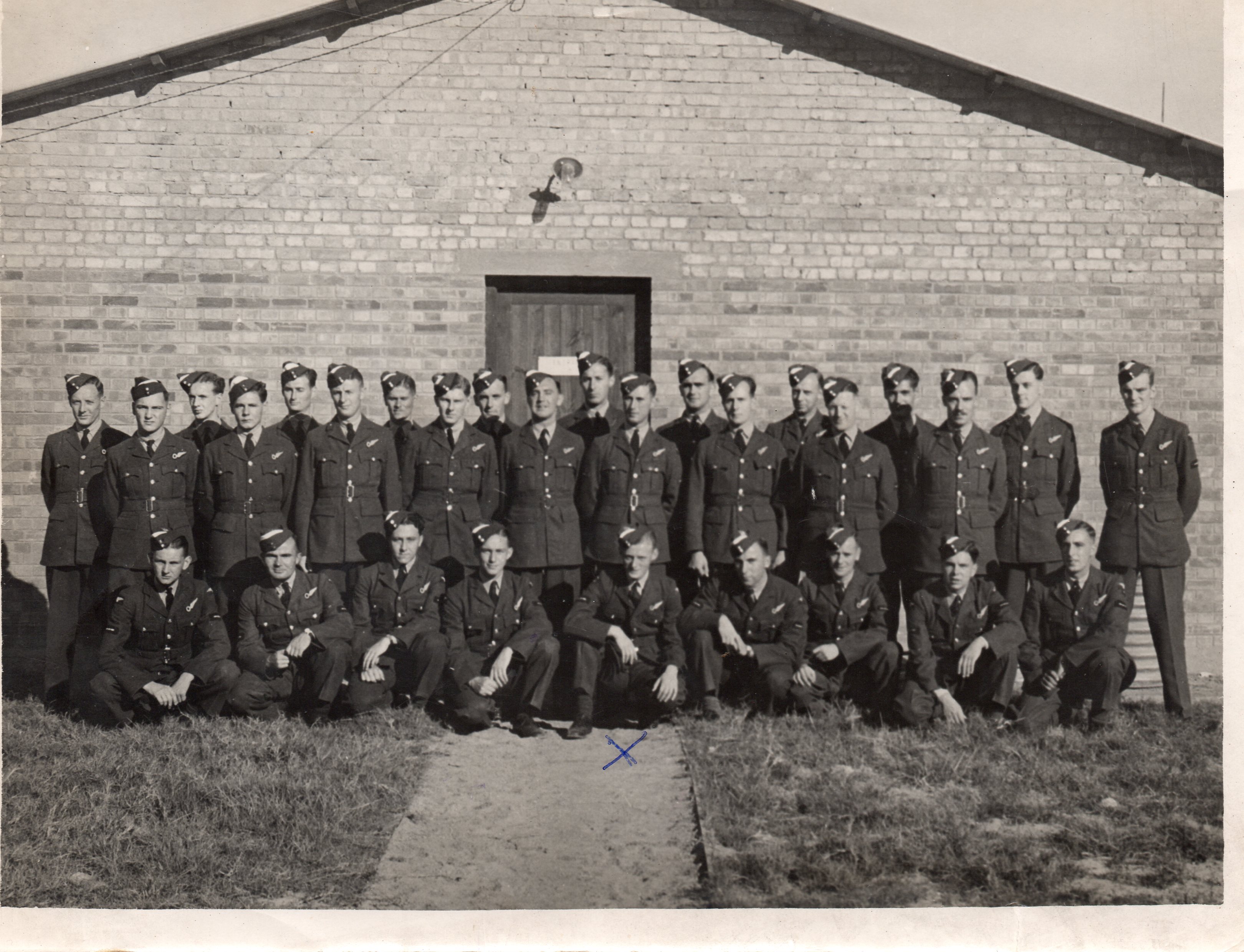 Group of 29 airmen, J C McGhee is indicated by the
          X.